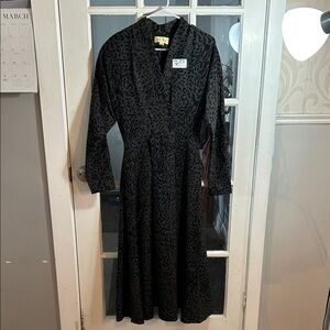 W76.    Vintage-Inspired Black Patterned Midi Dress